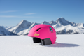 Pink Giro helmet with snow mountains background